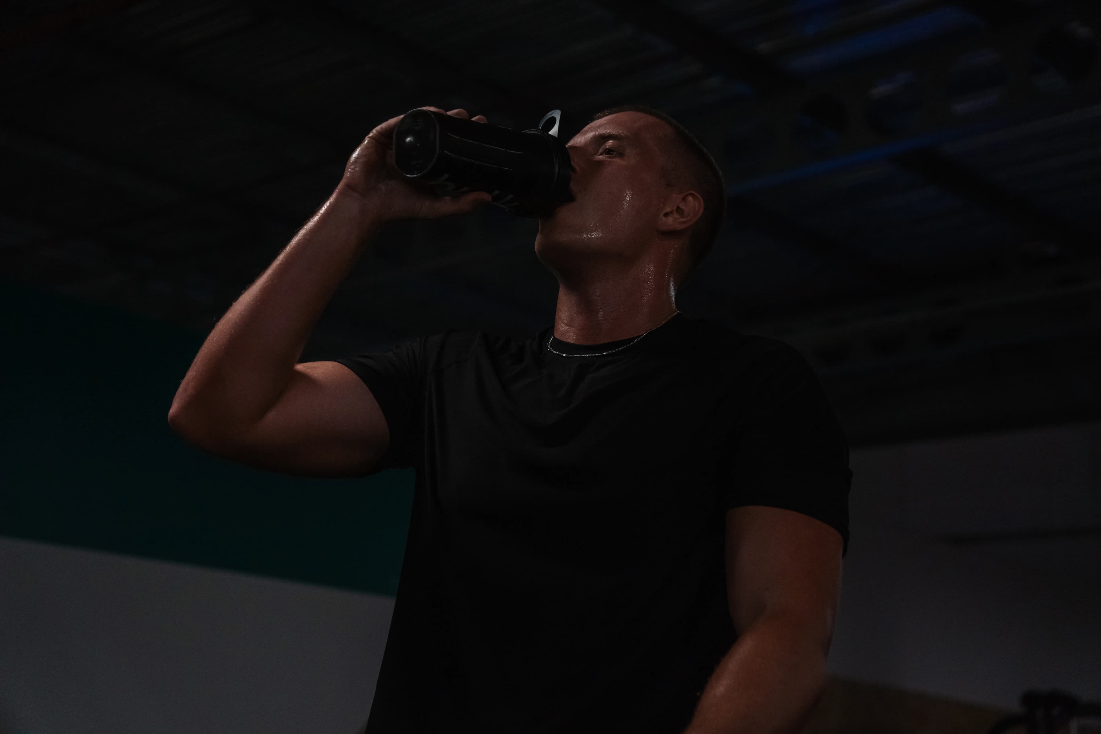 Founder of Built Around Fitness, Jack, drinking water during workout